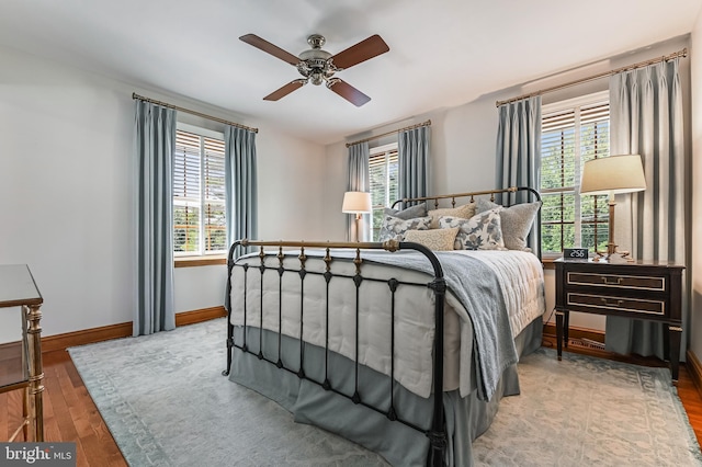 665 Bayard Rd, Lothian, MD 20711 - bedroom featuring multiple windows, wood finished floors, and baseboards