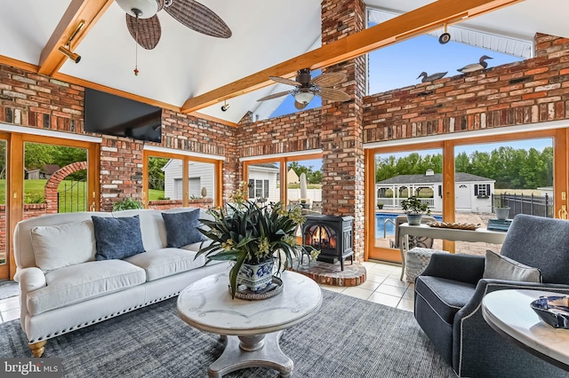 665 Bayard Rd, Lothian, MD 20711 - living area with ceiling fan, tile patterned floors, high vaulted ceiling, beam ceiling, and brick wall