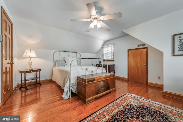 665 Bayard Rd, Lothian, MD 20711 - bedroom featuring hardwood / wood-style floors, baseboards, vaulted ceiling, and ceiling fan