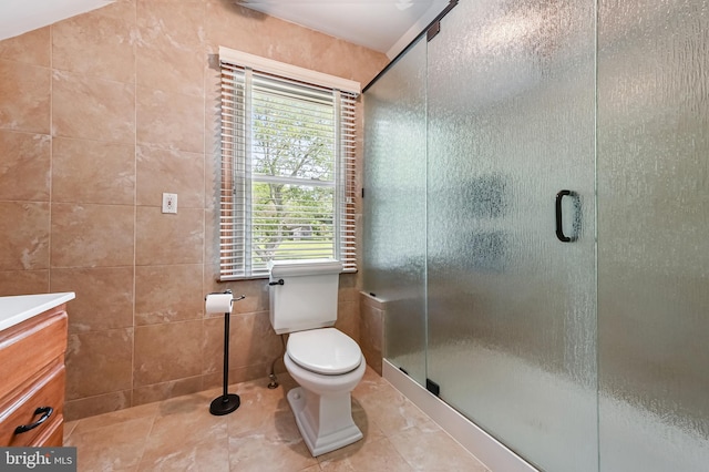 665 Bayard Rd, Lothian, MD 20711 - bathroom with tile walls, toilet, a shower stall, tile patterned floors, and vanity
