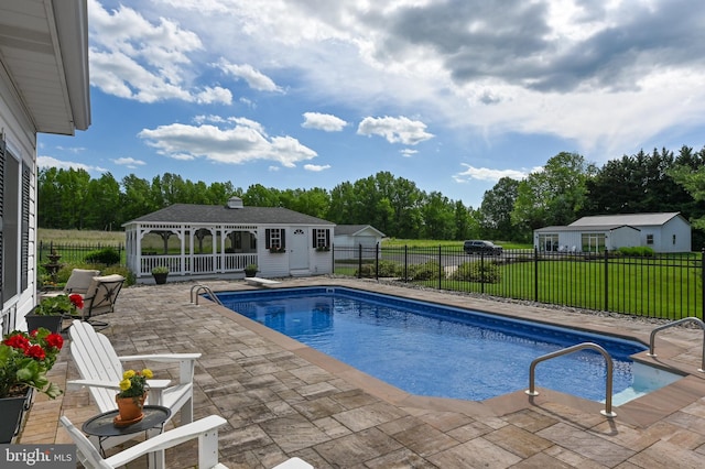 665 Bayard Rd, Lothian, MD 20711 - view of swimming pool with a patio, an outbuilding, a storage structure, and view of scattered trees