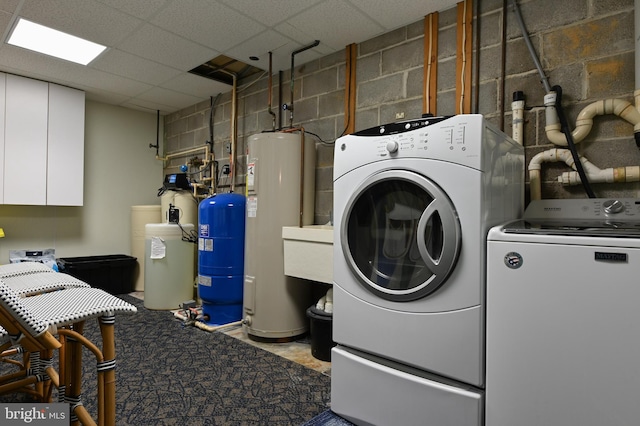 665 Bayard Rd, Lothian, MD 20711 - laundry room with separate washer and dryer, electric water heater, and concrete block wall