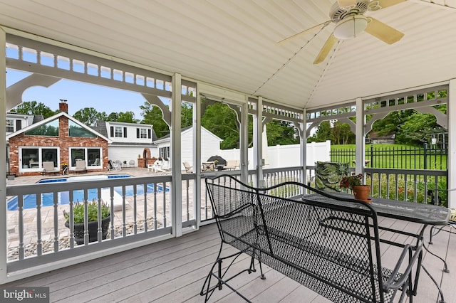 665 Bayard Rd, Lothian, MD 20711 - wooden deck with an outbuilding, a ceiling fan, and a patio area