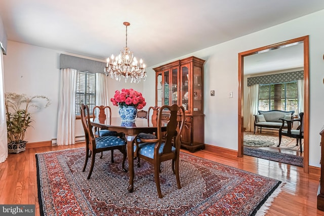 665 Bayard Rd, Lothian, MD 20711 - dining room with a chandelier, healthy amount of natural light, and light wood-style floors