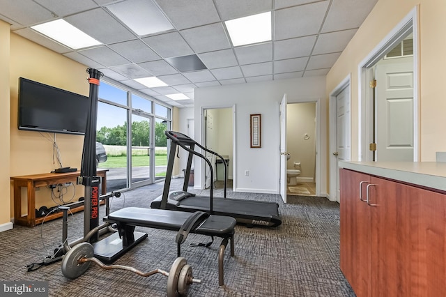 665 Bayard Rd, Lothian, MD 20711 - workout area with dark colored carpet, baseboards, and a paneled ceiling