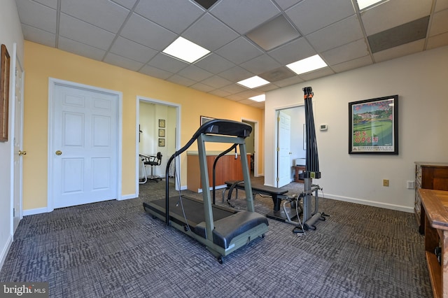 665 Bayard Rd, Lothian, MD 20711 - exercise room with dark colored carpet, a paneled ceiling, and baseboards