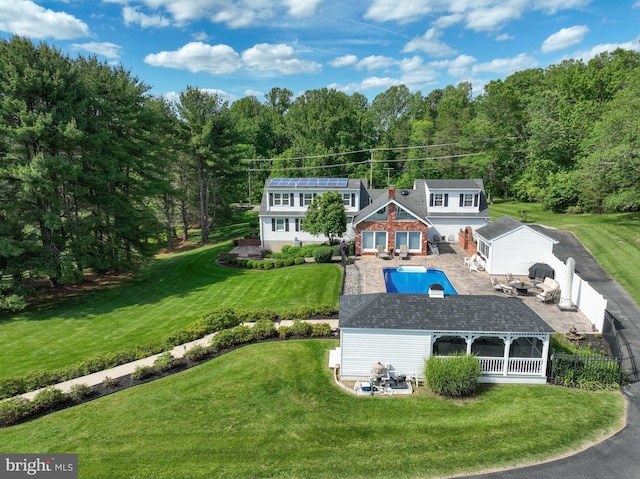 665 Bayard Rd, Lothian, MD 20711 - rear view of property featuring a patio area, an outdoor pool, and a wooded view