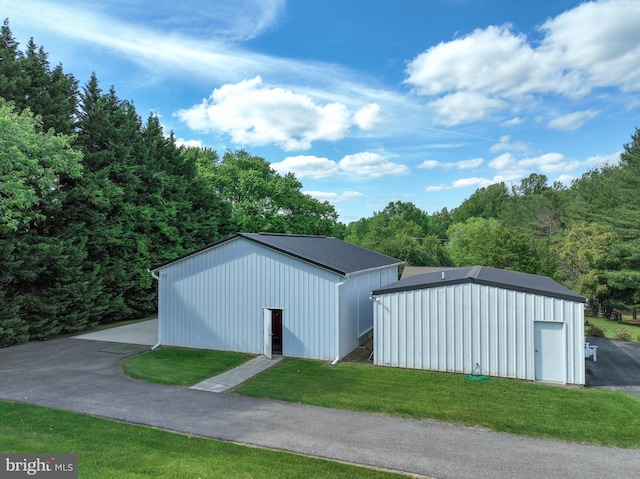 665 Bayard Rd, Lothian, MD 20711 - view of pole building with a lawn and a view of trees
