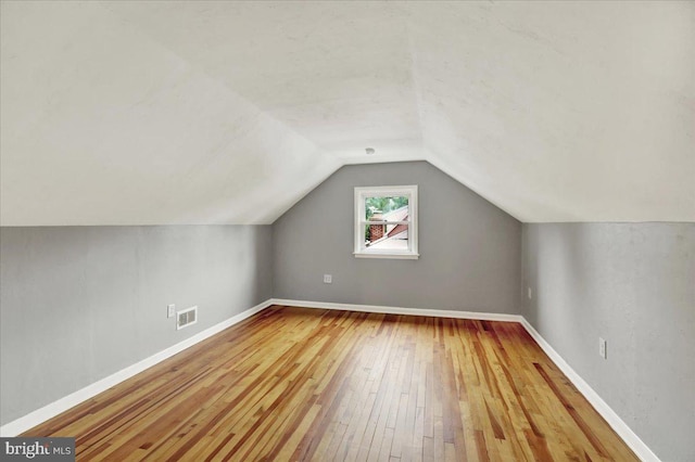 58 Wilson St, Reading, PA 19609 - bonus room with hardwood / wood-style flooring, vaulted ceiling, and baseboards