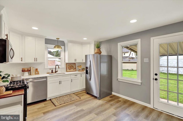 58 Wilson St, Reading, PA 19609 - kitchen with stainless steel appliances, a sink, light countertops, healthy amount of natural light, and recessed lighting