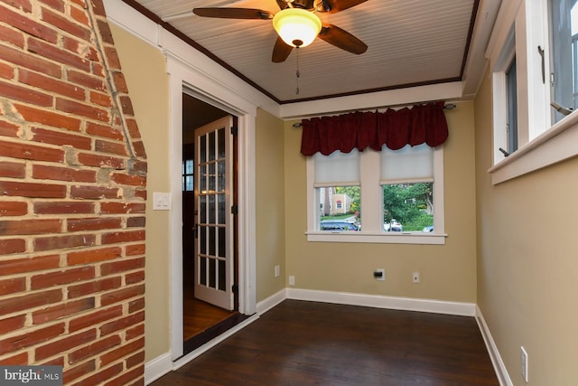67 N American St, Woodbury, NJ 08096 - spare room with dark wood-type flooring, ceiling fan, baseboards, and ornamental molding