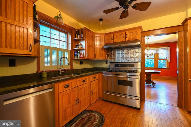 67 N American St, Woodbury, NJ 08096 - kitchen with stainless steel appliances, under cabinet range hood, a sink, and plenty of natural light
