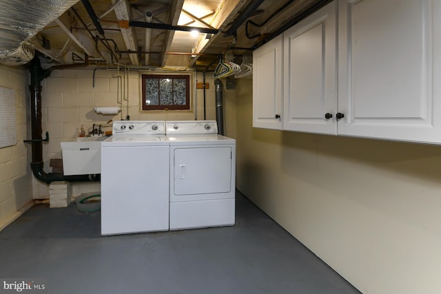 67 N American St, Woodbury, NJ 08096 - laundry room with washer and dryer, concrete block wall, and cabinet space