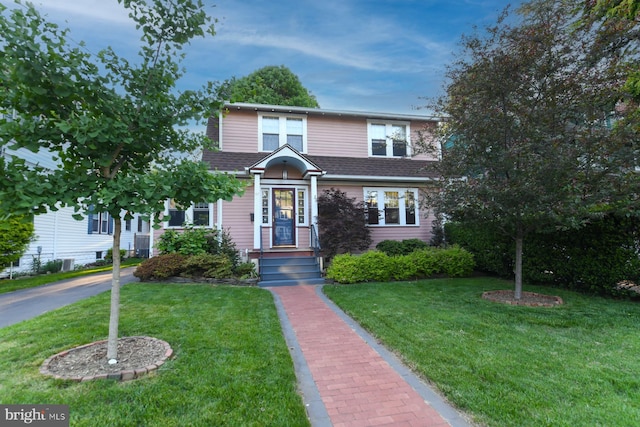 67 N American St, Woodbury, NJ 08096 - view of front of home featuring a front lawn and a shingled roof