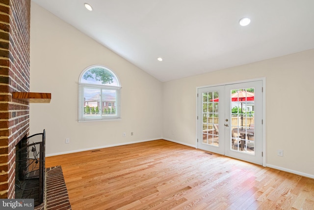 6188 Cobbs Rd, Alexandria, VA 22310 - unfurnished living room featuring french doors, wood finished floors, lofted ceiling, a fireplace, and recessed lighting