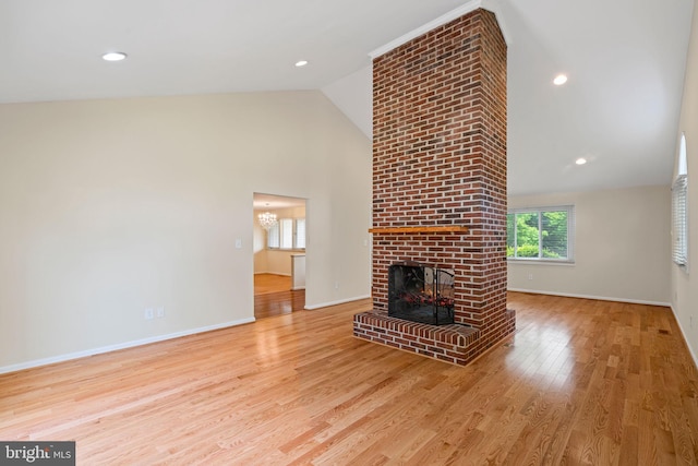 6188 Cobbs Rd, Alexandria, VA 22310 - unfurnished living room with a fireplace, wood finished floors, high vaulted ceiling, a chandelier, and recessed lighting
