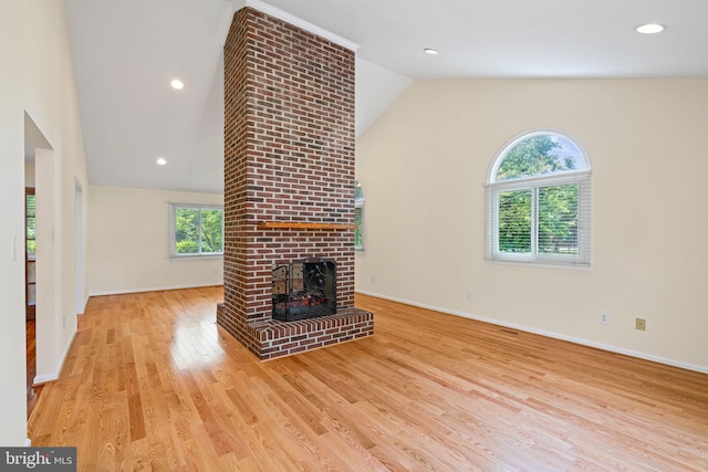 6188 Cobbs Rd, Alexandria, VA 22310 - unfurnished living room featuring lofted ceiling, a brick fireplace, and wood finished floors