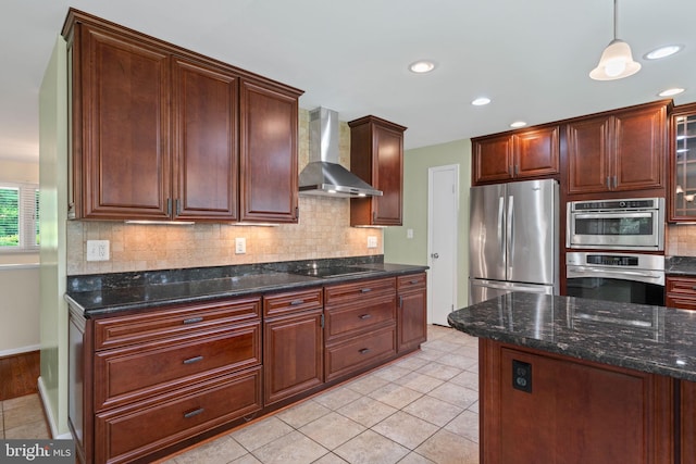 6188 Cobbs Rd, Alexandria, VA 22310 - kitchen featuring stainless steel appliances, wall chimney exhaust hood, tasteful backsplash, dark stone countertops, and light tile patterned floors