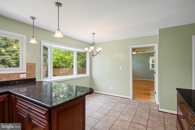 6188 Cobbs Rd, Alexandria, VA 22310 - kitchen featuring light tile patterned flooring, hanging light fixtures, backsplash, and a chandelier