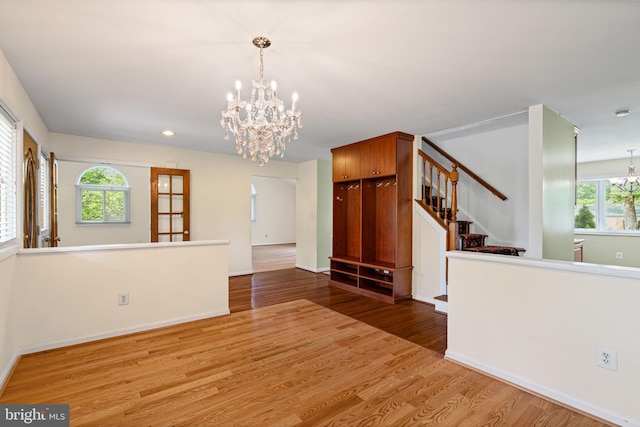 6188 Cobbs Rd, Alexandria, VA 22310 - empty room featuring a chandelier, wood finished floors, stairs, and recessed lighting