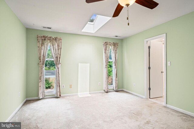 6188 Cobbs Rd, Alexandria, VA 22310 - unfurnished room with a ceiling fan, a skylight, and carpet floors