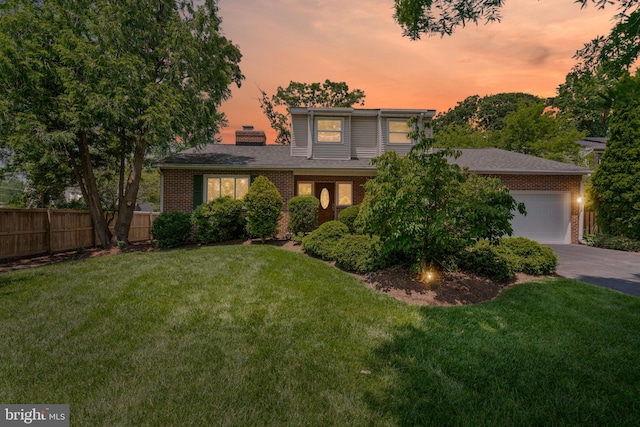 6188 Cobbs Rd, Alexandria, VA 22310 - view of front facade featuring concrete driveway, brick siding, a chimney, and an attached garage
