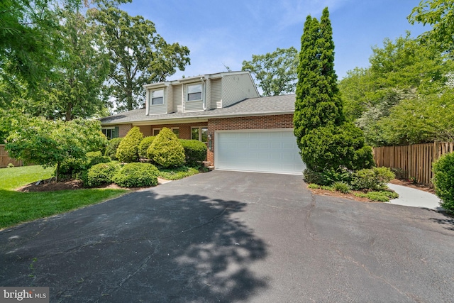 6188 Cobbs Rd, Alexandria, VA 22310 - view of front facade with driveway, a garage, brick siding, and a shingled roof