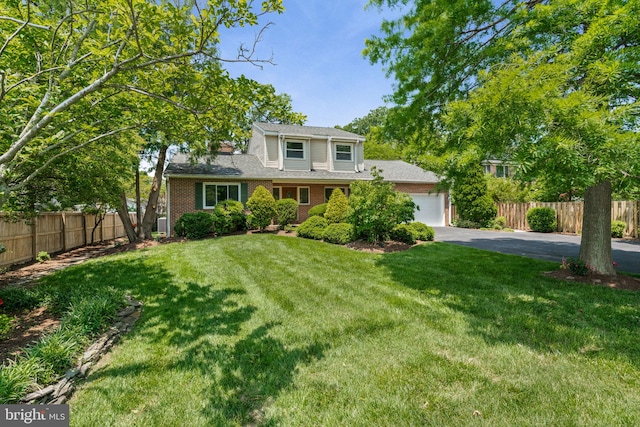 6188 Cobbs Rd, Alexandria, VA 22310 - traditional home with driveway, a garage, and brick siding