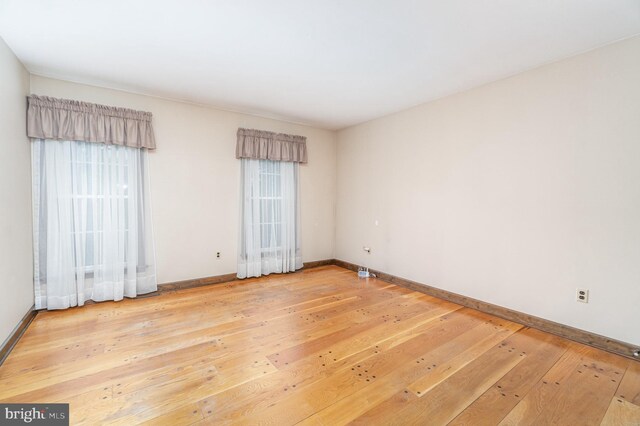 56 Pine Dr, Kirkwood, PA 17536 - empty room with wood-type flooring, plenty of natural light, and baseboards