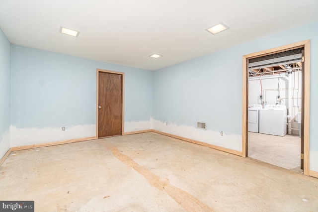 56 Pine Dr, Kirkwood, PA 17536 - unfurnished bedroom featuring washer and clothes dryer, unfinished concrete floors, and baseboards