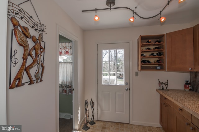 65 White Bark Dr, Middletown, DE 19709 - entryway with baseboards and track lighting