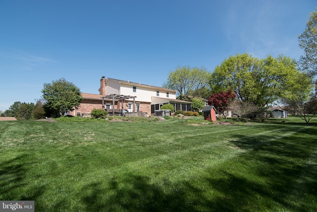 65 White Bark Dr, Middletown, DE 19709 - view of green lawn featuring a pergola