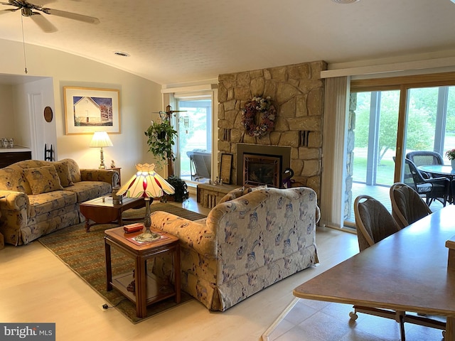108 Wright St SE, Frostburg, MD 21532 - living room with light wood finished floors, ceiling fan, lofted ceiling, and a fireplace