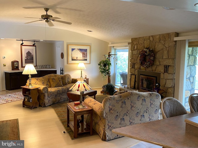 108 Wright St SE, Frostburg, MD 21532 - living area with wood finished floors, ceiling fan, a fireplace, and lofted ceiling