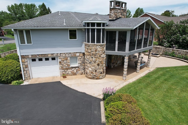 108 Wright St SE, Frostburg, MD 21532 - rear view of house with stone siding, roof with shingles, and a sunroom
