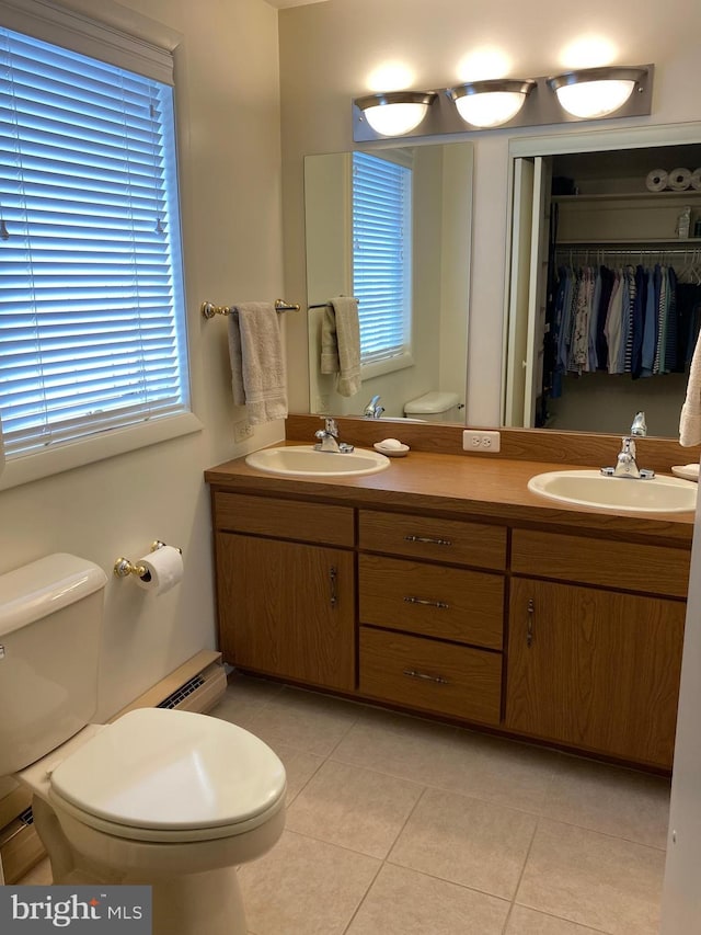 108 Wright St SE, Frostburg, MD 21532 - full bathroom with toilet, tile patterned floors, double vanity, and a baseboard heating unit