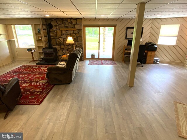 108 Wright St SE, Frostburg, MD 21532 - living room with a wood stove, a drop ceiling, wood finished floors, and a desk