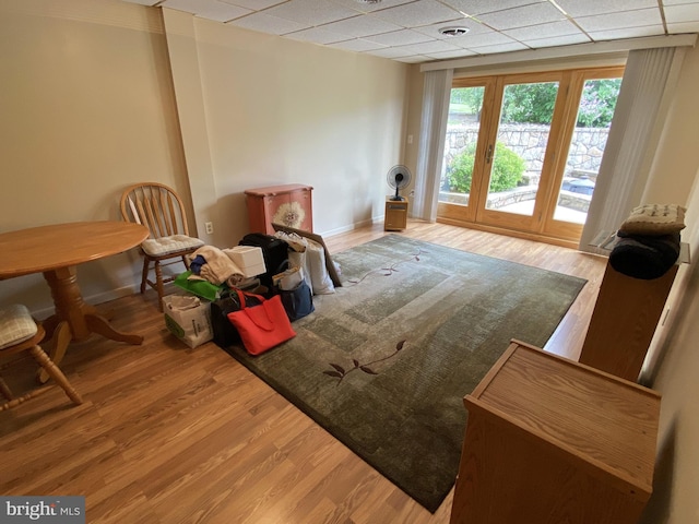 108 Wright St SE, Frostburg, MD 21532 - living area with a drop ceiling, wood finished floors, and baseboards
