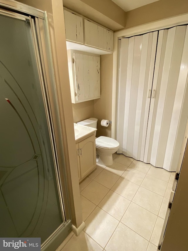 108 Wright St SE, Frostburg, MD 21532 - full bathroom featuring a shower stall, tile patterned flooring, toilet, and vanity