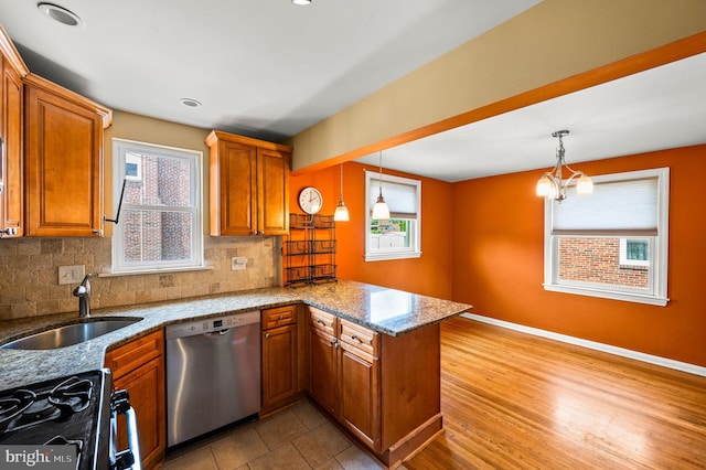 602 Braxton Rd, Ridley Park, PA 19078 - kitchen featuring dishwasher, brown cabinets, a sink, a peninsula, and recessed lighting