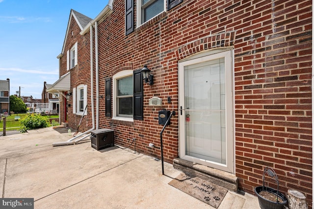602 Braxton Rd, Ridley Park, PA 19078 - view of exterior entry featuring brick siding and a patio area