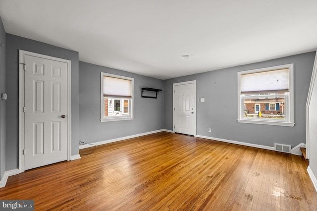 602 Braxton Rd, Ridley Park, PA 19078 - empty room with healthy amount of natural light, wood finished floors, and baseboards