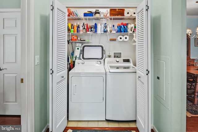 8145 Cyprus Cedar Ln Unit C, Ellicott City, MD 21043 - washroom with separate washer and dryer and a chandelier