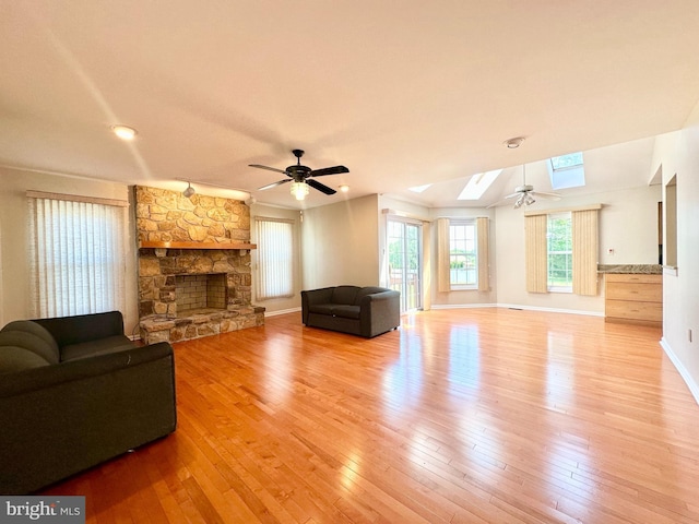 55 W Windrose Dr, Richboro, PA 18954 - living area featuring ceiling fan, a skylight, hardwood / wood-style flooring, a fireplace, and recessed lighting