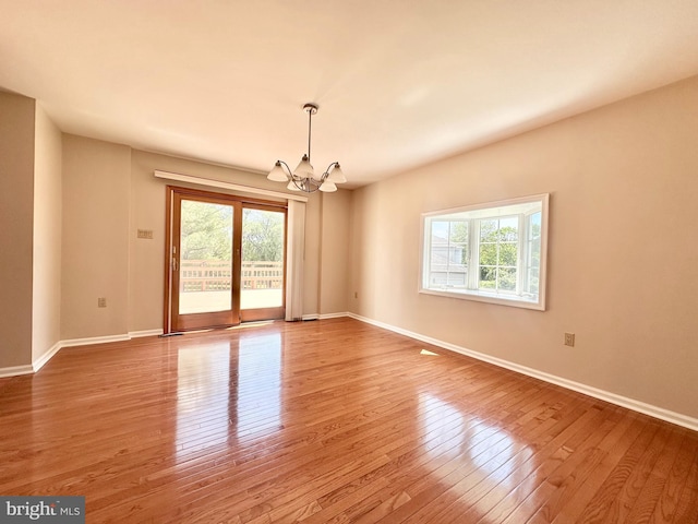 55 W Windrose Dr, Richboro, PA 18954 - unfurnished room with a chandelier, plenty of natural light, wood finished floors, and baseboards