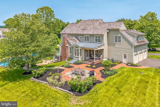 1293 Eagle Rd, New Hope, PA 18938 - back of house with a lawn, asphalt driveway, an attached garage, a patio area, and a deck