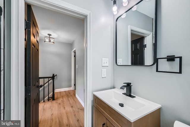 1235 Delbert, Baltimore, MD 21222 - half bath with vanity, wood finished floors, and baseboards