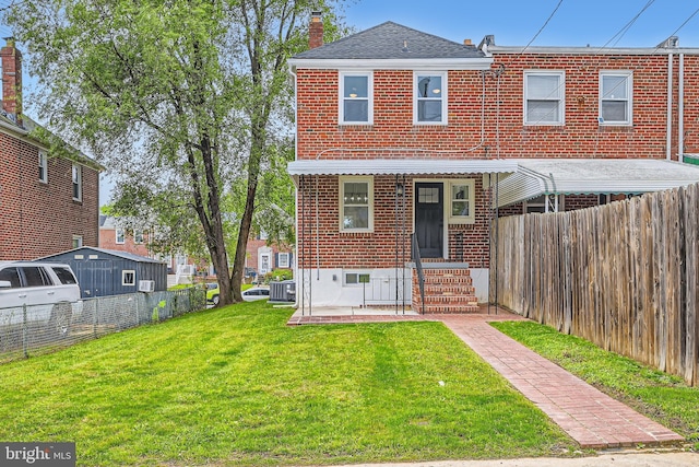 1235 Delbert, Baltimore, MD 21222 - rear view of property with brick siding, central air condition unit, a chimney, and roof with shingles
