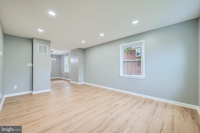 1235 Delbert, Baltimore, MD 21222 - empty room with a chandelier, light wood-type flooring, baseboards, and recessed lighting