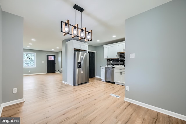 1235 Delbert, Baltimore, MD 21222 - kitchen with stainless steel appliances, light wood-type flooring, white cabinets, backsplash, and recessed lighting